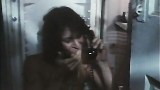 Vintage 1974 brunette MILF on phone in dimly lit room, Lady on the Couch