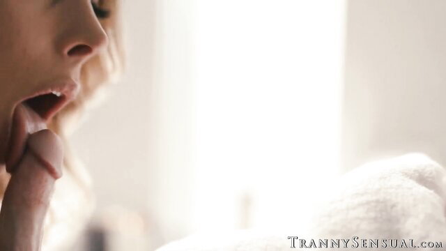 Blonde TS Ella Hollywood sensually sucking cock closeup