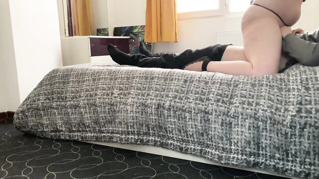 Persian MILF in lingerie and boots gives hot handjob on bed