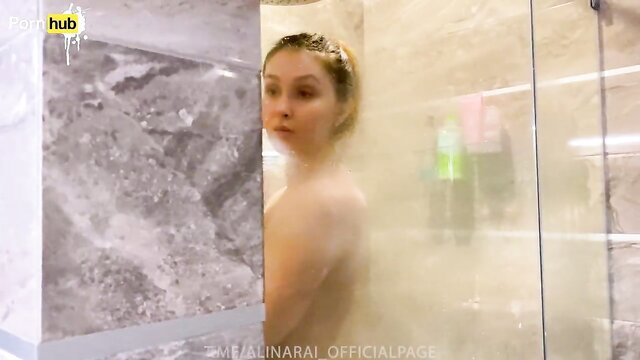 Steamy shower tease with wet Asian beauty peeking out nude