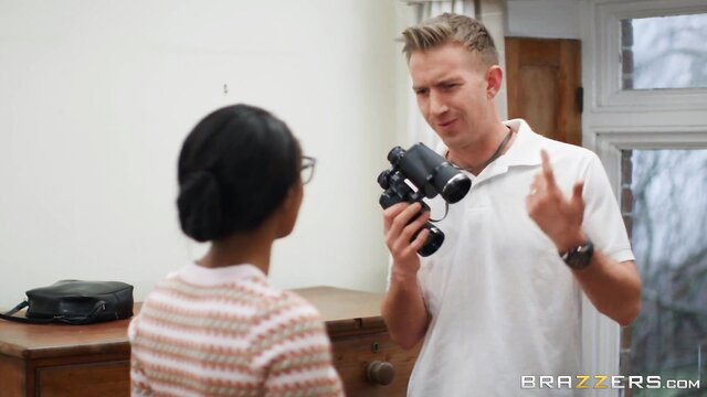Valentina Nappi with glasses turns from Danny D holding binoculars
