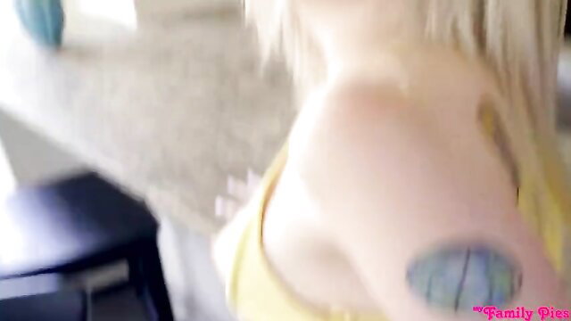 Blonde Lexi Lore in yellow top with blue tattoo, family pies scene