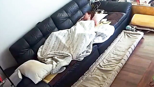 Asian mom sleeping nude under blanket on couch