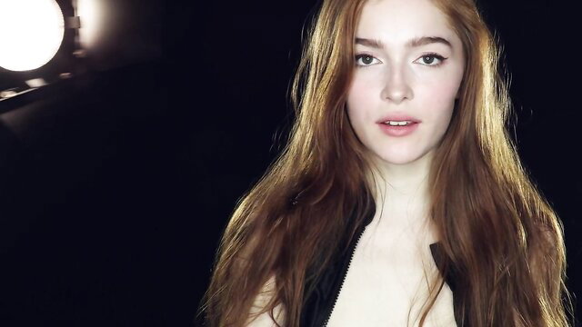 Lady Dee redhead beauty in leather jacket, seductive gaze