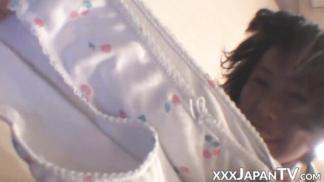Japanese girl upskirt panties ass view, smiling playfully