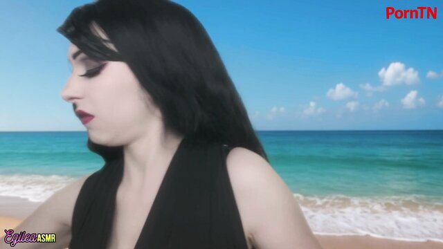 Egilea ASMR vampire girlfriend in black dress on sunny beach