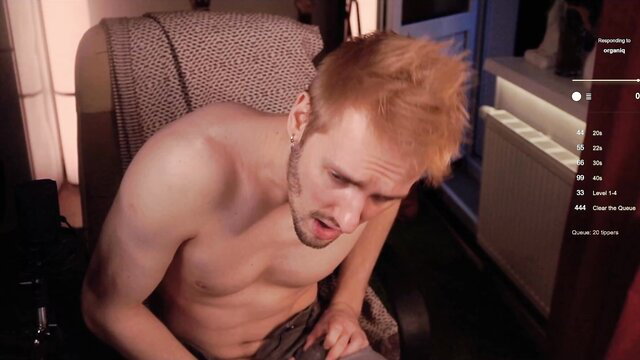 Redhead twink Enjohnny shirtless flexing abs in gayemo piercings video