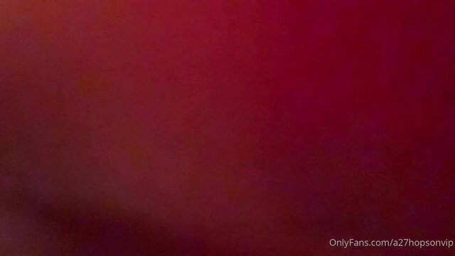 Hot seductive blonde wife in red glow, teasing pose HD