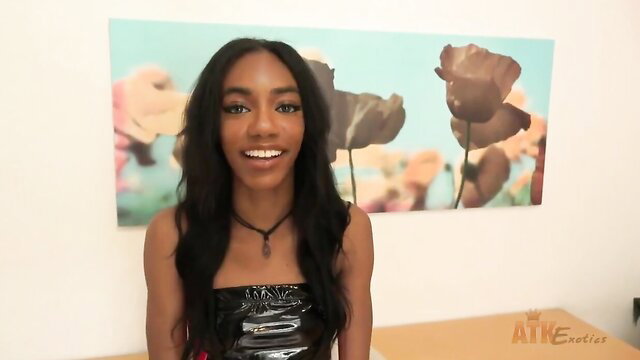 Chanel Skye skinny ebony babe in shiny black tube top smiling