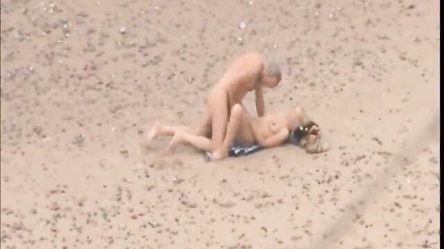 Old daddy fucks young blonde doggystyle on beach