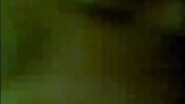Blurry green-tinted thumbnail of dark haired Indian plump woman in adult video