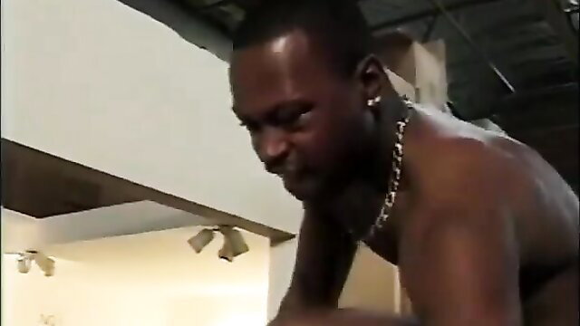 Muscular ebony man close-up, intense gaze in amateur adult scene