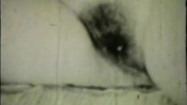 Close-up antique retro porn eye stare, grainy Color Climax loop thumbnail