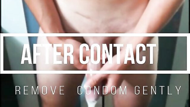 Man gently removing used condom after sex in closeup tutorial