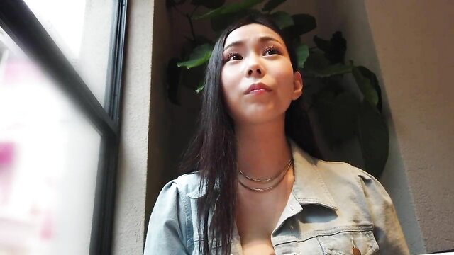 Asian beauty in open denim jacket flashing big tits, seductive gaze