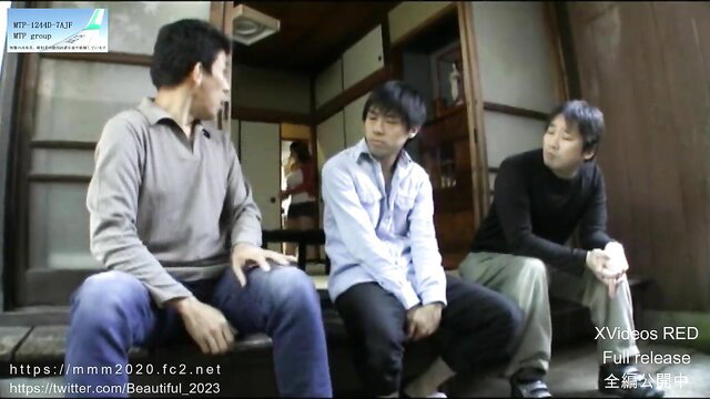 Three young Japanese men chatting casually on steps in JAV scene