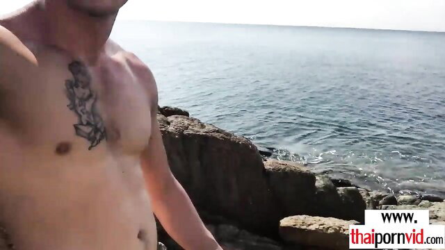 Thai teen Cherry sucking big white cock beach outdoor amateur