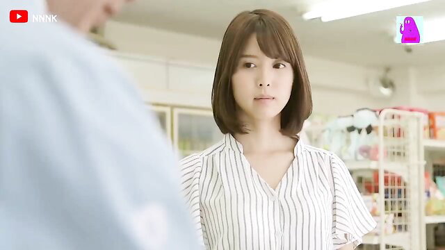 Cute Asian convenience store girl in striped blouse, flirty smile