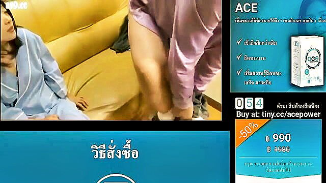 Asian woman in sheer lingerie spreading legs on yellow couch in sexy tease