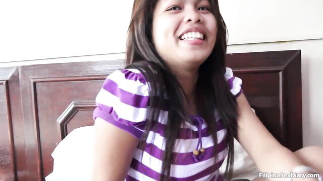 Smiling big booty Pinay in striped dress on bed, Asian Sex Diary