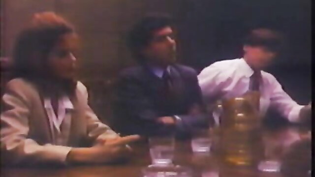 Deep Throat II 80s porn meeting: brunette with big hair, suited Indian guy, white exec