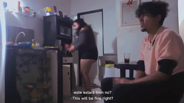 Amateur Latina couple in kitchen, girl in shorts cooking, guy watching playfully