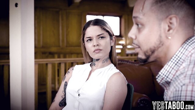 Tattooed Latina patient in white blouse eyed by pervert doctor in exam room