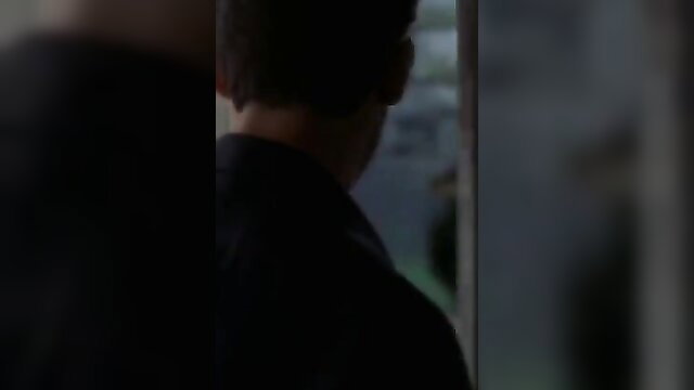 Rachel Shelley in black suit, seductive profile view from The Calling 2000