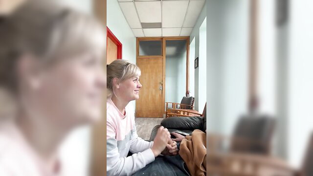 Blonde office slut kneels sucking boss cock in office