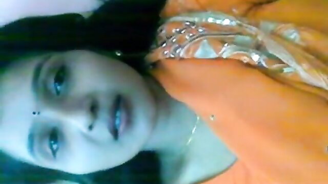 Hot Desi Indian babe in orange saree, closeup face for steamy affair