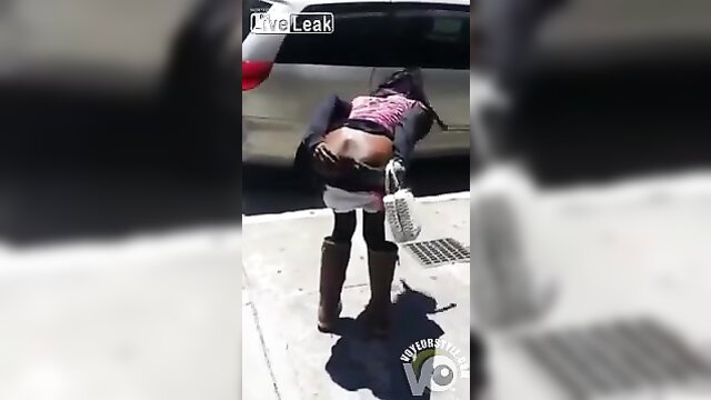 Crazy black lady bends over showing huge ass in tight pants outdoor