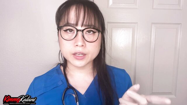 Kimmy Kalani hot Asian nurse in scrubs with stethoscope pointing at camera