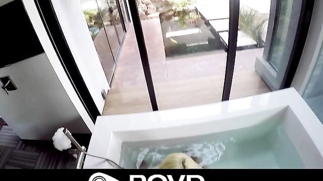 Blonde in bathtub giving oily handjob POV