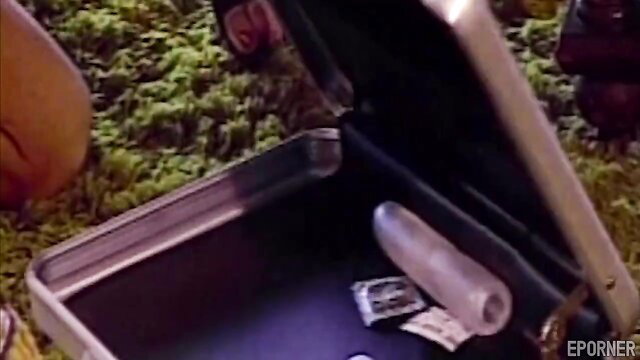 Perverted lesbians open sex toy case with condoms and dildo