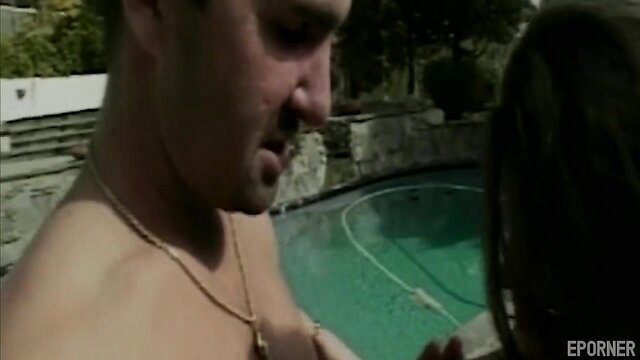Shirtless man whispers to long-haired woman by pool in steamy xxx scene