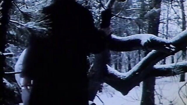 Olympic Fever 1979: shadowy figure grabs woman in snowy forest woods