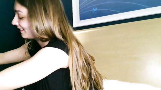 Skyemorgan01 blonde teen smiling in black tank top on bed