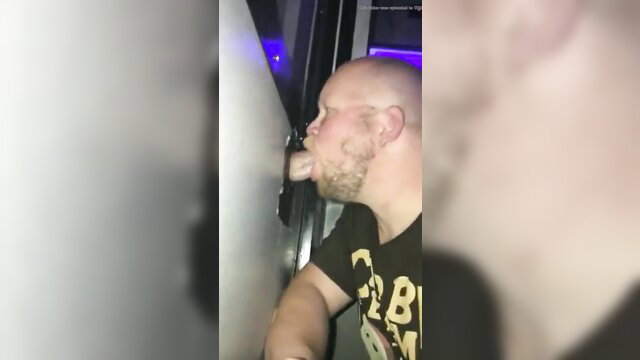 Bald ginger man eagerly sucking a huge cock closeup