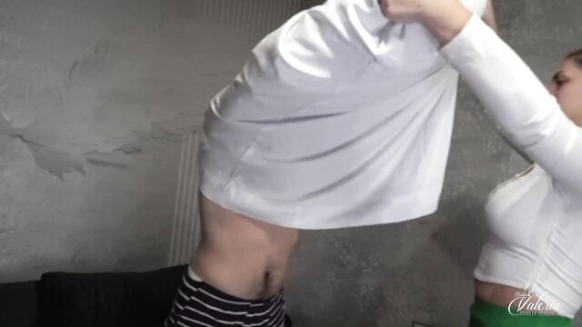 Goddess Valeria dominates slave, lifting shirt exposing abs in femdom tease