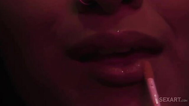 Bella Rolland's glossy lips teasing cigarette closeup
