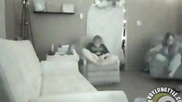 Two girlfriends masturbate together on couch in grainy homemade vid