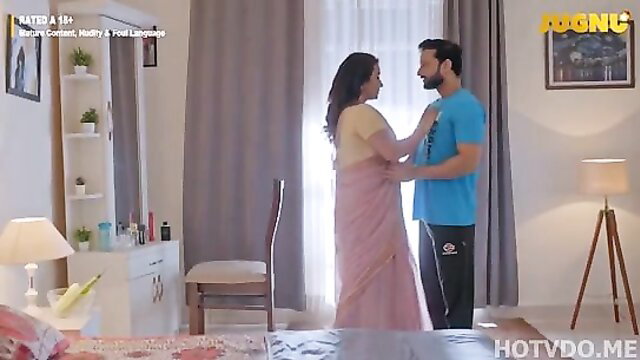Indian wife in pink saree embraces man in blue shirt, hot Hugnu web series