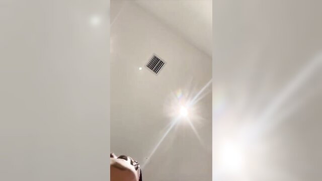 Young topless Arab babe tempts with perky tits in bright room