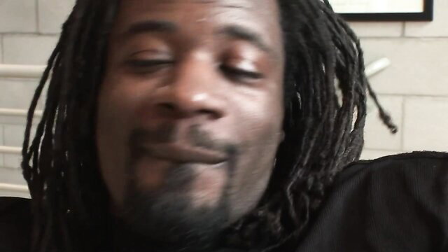 Closeup of smiling ebony man with dreadlocks in adult video thumbnail