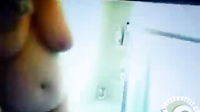 Mature big tits woman spied showering nude closeup