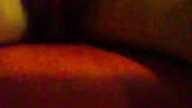 Horny bitch in red seat, teasing with yellow toy closeup