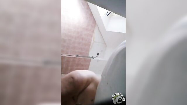 Amateur babe ignores camera, showers nude in steamy bathroom