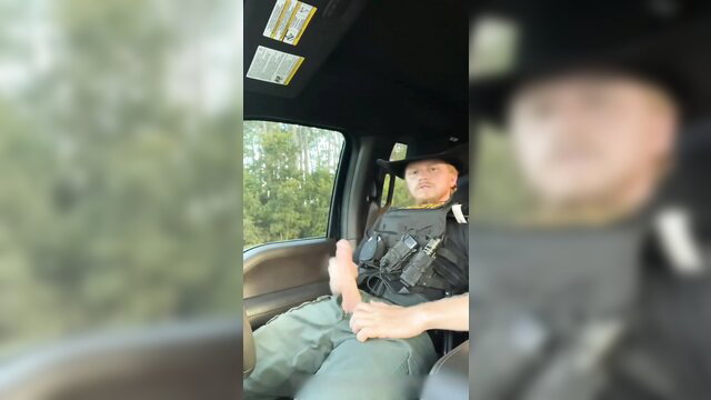 Sheriff jerking his cock in police cruiser