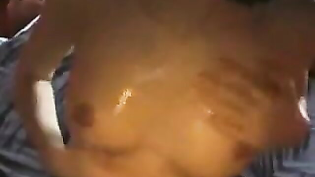 Amateur babe's oiled big tits with handprints, craving hard pounding