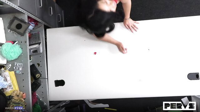 Scarlett Alexis caught shoplifting, bent over desk in red top, reaching on floor